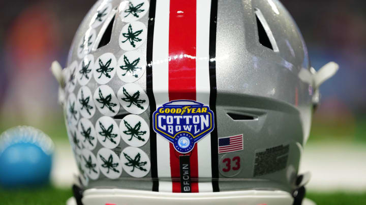 Dec 29, 2023; Arlington, Texas, USA; The helmet of Ohio State Buckeyes quarterback Devin Brown (33) sits on the sideline prior to the Goodyear Cotton Bowl Classic against the Missouri Tigers at AT&T Stadium.