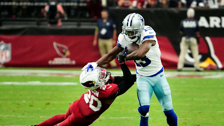 Dallas Cowboys wide receiver Michael Gallup pushes aside Arizona Cardinals cornerback Marco Wilson. Dallas Cowboys wide receiver Michael Gallup pushes aside Arizona Cardinals cornerback Marco Wilson.