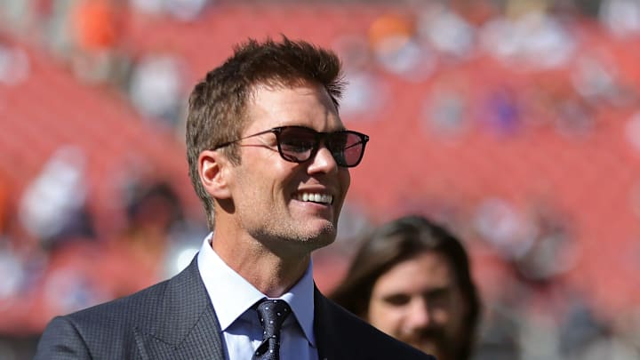 NFL legend Tom Brady is all smiles before an NFL football game at Huntington Bank Field, Sunday, Sept. 8, 2024, in Cleveland, Ohio.