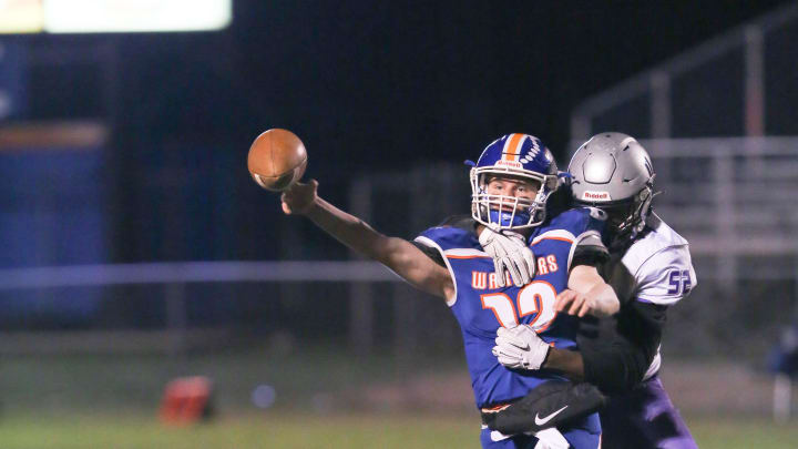 Joppatowne's Zion Elee wraps up Boonsboro QB Colin Telemeco as he releases the ball.