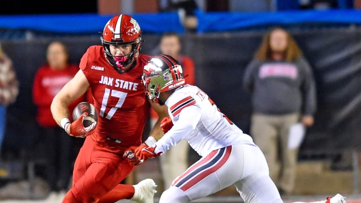 Jacksonville State's Sean Brown tries to evade the tackle of Western Kentucky's Takulve Williams during college football action at Burgess-Snow Field Jacksonville State Stadium in Jacksonville, Alabama October 17, 2021. (Dave Hyatt: Hyatt Media LLC)