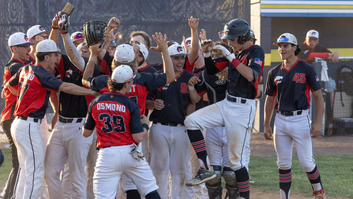 Jackson Charlie Meglio is greeted at the plate as he crosses the plate with a home run. Jackson Memorial defeats Central Regional 11-2 in Ocean County Baseball Final at Toms River on June 8, 2022.

Ocfinal220608c