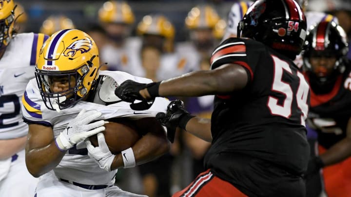 Canton McKinley's Dior Garner (54) makes a tackle against Avon during a high school football game, Friday, Aug. 25, 2023.