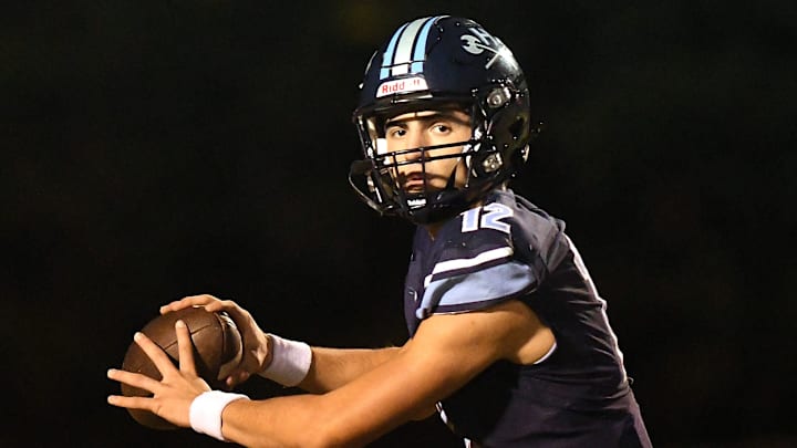 Hoggard's #12 Matthew Boring passes the ball as Hoggard took on Mill Brook Friday Nov. 29, 2024 at Scott Braswell Stadium in Wilmington, N.C. Hoggard beat Mill Brook in Round 3 of the 2024 NCHSAA 4A East playoffs 28-21. KEN BLEVINS/STARNEWS Hoggard's #12 Matthew Boring passes the ball as Hoggard took on Mill Brook Friday Nov. 29, 2024 at Scott Braswell Stadium in Wilmington, N.C. Hoggard beat Mill Brook in Round 3 of the 2024 NCHSAA 4A East playoffs 28-21. KEN BLEVINS/STARNEWS