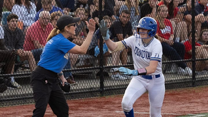 Donovan’s Isabella Cino gets a high five from her coach after hitting a two run homer to put her team down 5-3. St. John Vianney Girls Softball defeats Red Bank Catholic 10-9 in the ninth inning of Shore Conference Tournament final in Red Bank, NJ on May 21, 2024 Donovan’s Isabella Cino gets a high five from her coach after hitting a two run homer to put her team down 5-3. St. John Vianney Girls Softball defeats Red Bank Catholic 10-9 in the ninth inning of Shore Conference Tournament final in Red Bank, NJ on May 21, 2024