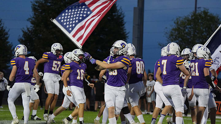 Nevada team enters the field before the football game against Clear Lake in the Iowa high school week-4 at Cubs Stadium on Sept 19, 2025, in Nevada, Iowa.