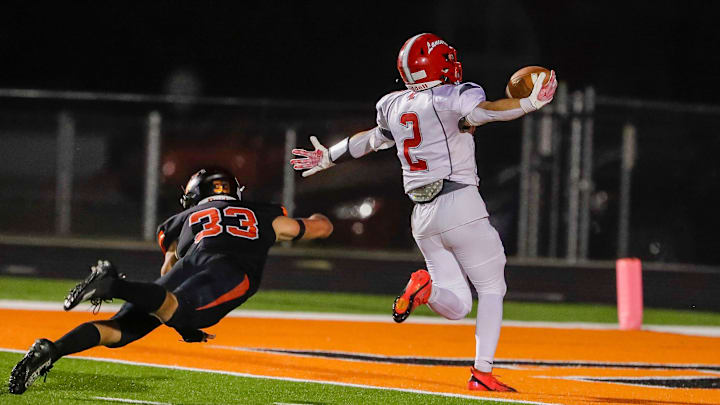 Manitowoc Lutheran’s Isaiah Muchka (2) celebrates a touchdown as Cedar Grove-Belgium’s Ira Hilbelink (23) misses the tackle, Friday, September 12, 2025, in Cedar Grove, Wis. Manitowoc Lutheran’s Isaiah Muchka (2) celebrates a touchdown as Cedar Grove-Belgium’s Ira Hilbelink (23) misses the tackle, Friday, September 12, 2025, in Cedar Grove, Wis.