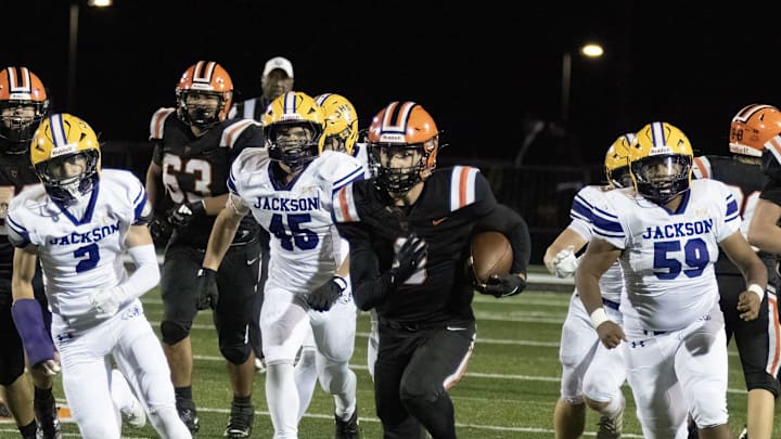 Hoover’s Jack Andes breaks a long run for a touchdown giving Hoover a lead 35-14 over Jackson with 3:28 to go in the game Friday, Oct. 24 2025. Bob Rossiter / Special To The Canton Repository