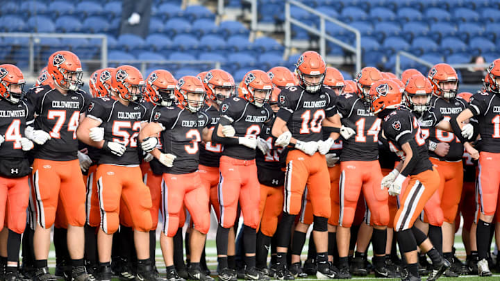 Coldwater players prepare to take the field against Kirtland in OHSAA Division VI state final at Tom Benson Hall of Fame Stadium. Saturday, Dec. 7, 2024