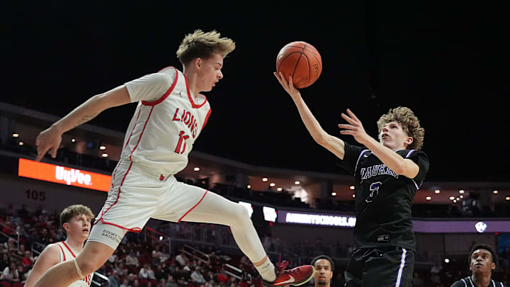 Waukee's guard Max Roach (3) goes for a layup around Linn-Mar's guard Mason Matson (11) during the second quarter in the 4A IHSAA boys state basketball quarter-final at Wells Fargo Arena on Monday, March 10, 2025, in Des Moines, Iowa.