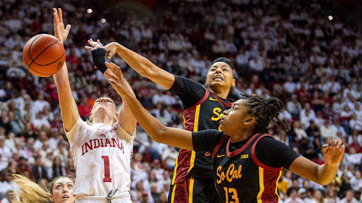 Indiana's Lexus Bargesser (1) is stopped by USC's JuJu Watkins (12) and Rayah Marshall (13) during the Indiana versus University of Southern California women's basektball game at Simon Skjodt Assembly Hall on Sunday, Jan. 19, 2025. Indiana's Lexus Bargesser (1) is stopped by USC's JuJu Watkins (12) and Rayah Marshall (13) during the Indiana versus University of Southern California women's basektball game at Simon Skjodt Assembly Hall on Sunday, Jan. 19, 2025.