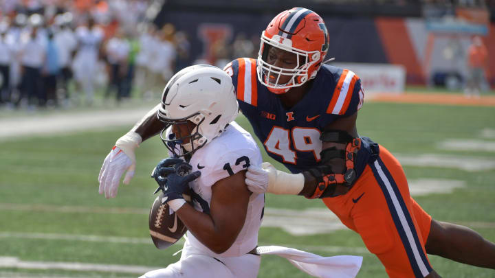 Sep 16, 2023; Champaign, Illinois, USA;  Penn State Nittany Lions running back Kaytron Allen (13) cannot make a catch near the end zone against Illinois Fighting Illini linebacker Seth Coleman (49) during the first half at Memorial Stadium. Mandatory Credit: Ron Johnson-USA TODAY Sports