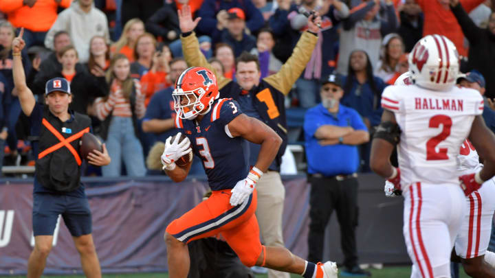 Oct 21, 2023; Champaign, Illinois, USA;  Illinois Fighting Illini running back Kaden Feagin (3) scores a touchdown during the second half against the Wisconsin Badgers at Memorial Stadium. Mandatory Credit: Ron Johnson-USA TODAY Sports