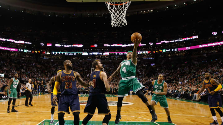 Apr 5, 2017; Boston, MA, USA; Boston Celtics guard Isaiah Thomas (4) drives to the basket against Cleveland Cavaliers forward Kevin Love (0) and forward LeBron James (23) in the second quarter at TD Garden. Mandatory Credit: David Butler II-USA TODAY Sports