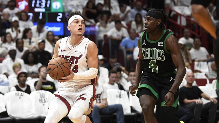 Apr 29, 2024; Miami, Florida, USA; Miami Heat guard Tyler Herro (14) looks for a shot against Boston Celtics guard Jrue Holiday (4) during the first quarter of game four of the first round for the 2024 NBA playoffs at Kaseya Center. Mandatory Credit: Michael Laughlin-USA TODAY Sports