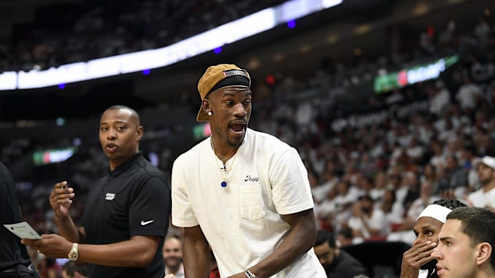 Apr 29, 2024; Miami, Florida, USA; Miami Heat forward Jimmy Butler (22) comments on the game from the bench during the first quarter of game four of the first round for the 2024 NBA playoffs, against the Boston Celtics, at Kaseya Center. Mandatory Credit: Michael Laughlin-Imagn Images