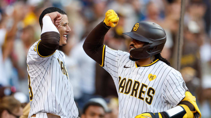 Jul 31, 2024; San Diego, California, USA; San Diego Padres catcher Luis Campusano (12) celebrates with San Diego Padres third baseman Manny Machado (13) after hitting a home run during the fourth inning against the Los Angeles Dodgers at Petco Park. Mandatory Credit: David Frerker-USA TODAY Sports