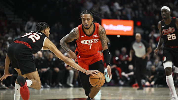 Apr 12, 2024; Portland, Oregon, USA; Portland Trail Blazers guard Rayan Rupert (72) steals the basketball during the first half against Houston Rockets forward Cam Whitmore (7) at Moda Center. Mandatory Credit: Troy Wayrynen-Imagn Images