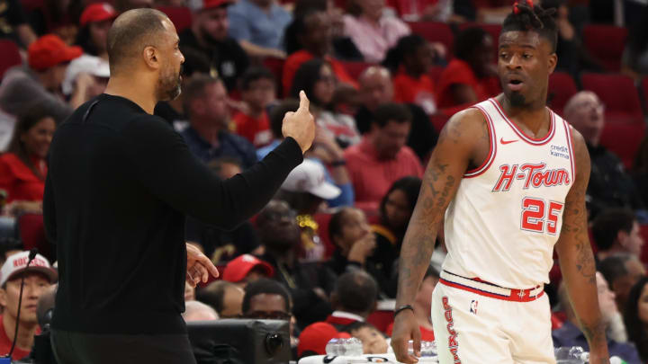 Mar 16, 2024; Houston, Texas, USA; Houston Rockets head coach Ime Udoka talks to forward Reggie Bullock Jr. (25) while playing against the Cleveland Cavaliers in the second quarter at Toyota Center. Mandatory Credit: Thomas Shea-USA TODAY Sports