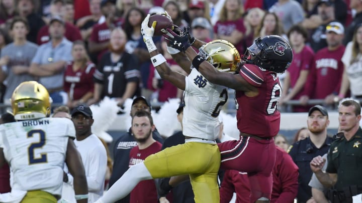 Notre Dame Fighting Irish cornerback Benjamin Morrison (20) intercepts a late second quarter pass intended for South Carolina Gamecocks wide receiver O'Mega Blake (89). The University of Notre Dame Fighting Irish took on the University of South Carolina Gamecocks in the TaxSlayer Gator Bowl game in Jacksonville, Florida's TIAA Bank Field Friday, December 30, 2022. The first half ended with South Carolina holding a 24 to 17 lead. [Bob Self/Florida Times-Union]

Jki 123022 Bs Gatorbowl