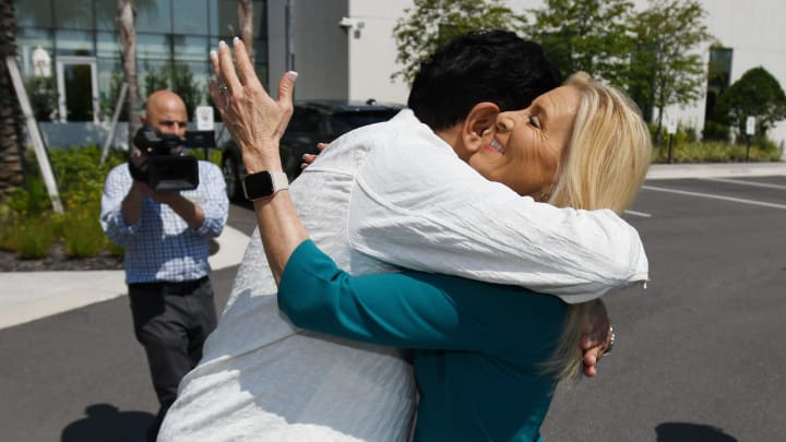 Jacksonville Jaguars owner Shad Khan and Jacksonville Mayor Donna Deegan hug as they greet each other outside the Jaguars Miller Electric Center ahead of Wednesday's event following Tuesday evening's successful vote by the city council approving the new Stadium renovation deal with the Jaguars. Jacksonville Jaguars owner Shad Khan, Jaguars president Mark Lamping, Jacksonville Mayor Donna Deegan and the city of Jacksonville's chief negotiator on the stadium deal Mike Weinstein met at the Jaguars