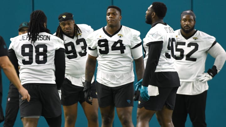 Jacksonville Jaguars defensive tackle Jordan Jefferson (98), defensive end Tyler Lacy (93), defensive tackle Maason Smith (94), defensive end Esezi Otomewo (90) and defensive tackle DaVon Hamilton (52) line up for drills. The Jacksonville Jaguars let most of the veterans off from participating in Monday's mandatory minicamp session held in the air conditioned enclosed field at EverBank Stadium's Miller Electric Center in Jacksonville, Fla. June 10, 2024. [Bob Self/Florida Times-Union]
