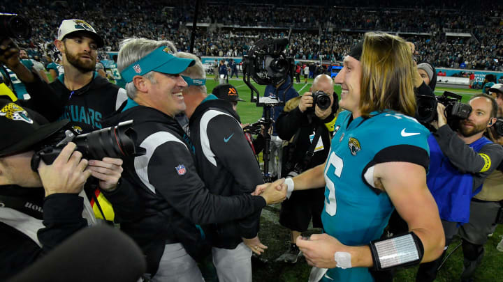 Jacksonville Jaguars head coach Doug Pederson and Jacksonville Jaguars quarterback Trevor Lawrence (16) greet each other after Saturday night's victory over the Tennessee Titans, clinching the AFC South title. The Jacksonville Jaguars hosted the Tennessee Titans to decide the AFC South championship at TIAA Bank Field in Jacksonville, FL, Saturday, January 7, 2023. The Jaguars went into the half trailing 7 to 13 but came back to win with a final score of 20 to 16. [Bob Self/Florida