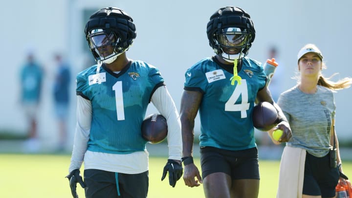 Jacksonville Jaguars running back Travis Etienne Jr. (1) and running back Tank Bigsby (4) walk together during the fourth day of the NFL football training camp practice session Saturday, July 27, 2024 at EverBank Stadium's Miller Electric Center in Jacksonville, Fla. [Bob Self/Florida Times-Union]