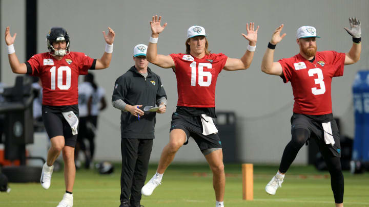 Jacksonville Jaguars quarterbacks Mac Jones (10), Trevor Lawrence (16) and C.J. Beathard (3) go through warm up exercises under the watchful eye of Lawrence's strength coach/nutritionist, Will Wynkoop during the second day of an NFL football training camp practice session Thursday, July 25, 2024 at EverBank Stadium's Miller Electric Center in Jacksonville, Fla.