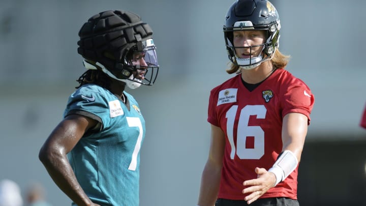 Jacksonville Jaguars wide receiver Brian Thomas Jr. (7) and quarterback Trevor Lawrence (16) talk between drills on the fifth day of the NFL football training camp practice session Monday, July 29, 2024 at EverBank Stadium's Miller Electric Center in Jacksonville, Fla..