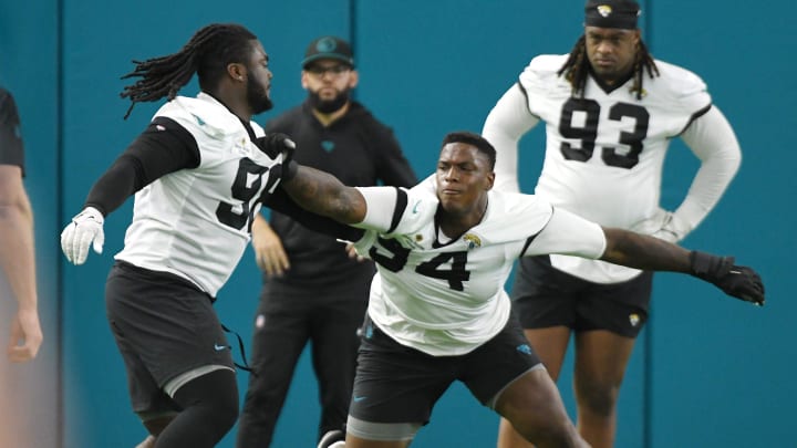 Jacksonville Jaguars defensive tackle Jordan Jefferson (98) and defensive tackle Maason Smith (94) face off during drills as defensive end Tyler Lacy (93) looks on. The Jacksonville Jaguars let most of the veterans off from participating in Monday's mandatory minicamp session held in the air conditioned enclosed field at EverBank Stadium's Miller Electric Center in Jacksonville, Fla. June 10, 2024.