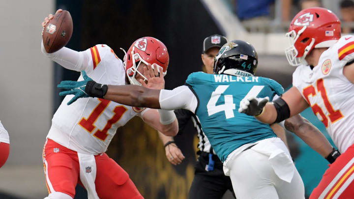 Kansas City Chiefs quarterback Carson Wentz (11) is pressured by Jacksonville Jaguars defensive end Travon Walker (44) during first quarter action. The Jaguars led 20 to 10 at the end of the first half. The Jacksonville Jaguars hosted the Kansas City Chiefs in the Jaguars first preseason game of the season Saturday, August10, 2024 at EverBank Stadium in Jacksonville, Fla. [Bob Self/Florida Times-Union]