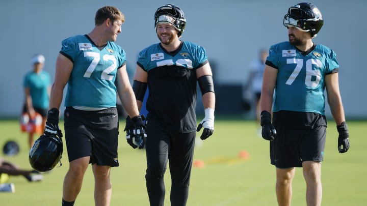 Jacksonville Jaguars offensive tackle Walker Little (72), center Luke Fortner (79) and guard Ezra Cleveland (76) walk onto the field at the start of the fourth day of the NFL football training camp practice session Saturday, July 27, 2024 at EverBank Stadium's Miller Electric Center in Jacksonville, Fla. [Bob Self/Florida Times-Union]