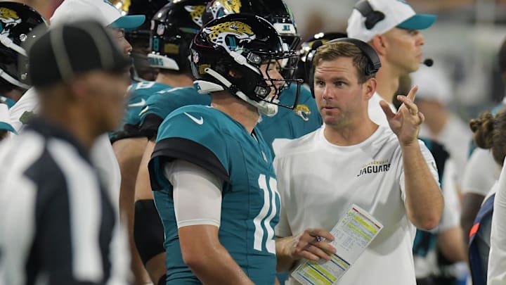 Jaguars offensive coordinator Press Taylor talks with Jacksonville Jaguars quarterback Mac Jones (10) on the sidelines during second half action of Saturday's game against the Chiefs. The Jaguars came away with a 26 to 13 victory over the Kansas City Chiefs. The Jacksonville Jaguars hosted the Kansas City Chiefs in the Jaguars first preseason game of the season Saturday, August 10, 2024 at EverBank Stadium in Jacksonville, Fla. [Bob Self/Florida Times-Union]