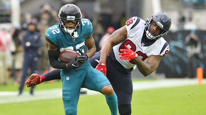 Jacksonville Jaguars cornerback Tyson Campbell (32) intercepts a pass intended for Houston Texans tight end Jordan Akins (88) during fourth quarter action. The Jacksonville Jaguars hosted the Houston Texans at TIAA Bank Field in Jacksonville, Florida Sunday, December 19, 2021. The Jaguars fell to the Texans with a final score of 30 to 16. [Bob Self/Florida Times-Union]