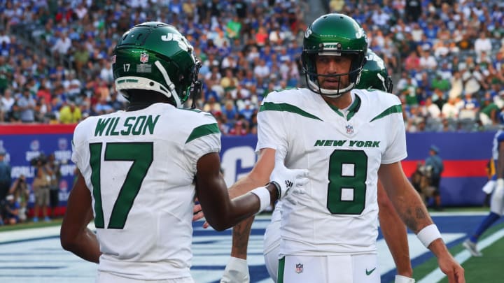 Aug 26, 2023; East Rutherford, NJ; New York Jets quarterback Aaron Rodgers (8) celebrates his touchdown pass against the New York Giants during the first half at MetLife Stadium. 