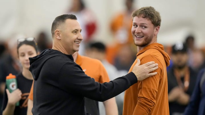 Head coach Steve Sarkisian greets quarterback Quinn Ewers who threw passes to receivers at Texas Longhorns Football Pro Day at Frank Denius Fields Wednesday March 20, 2024.