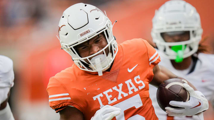 Texas Orange team wide receiver Ryan Wingo (5) runs the ball in for a touchdown during the Longhorns' spring Orange and White game at Darrell K Royal Texas Memorial Stadium in Austin, Texas, April 20, 2024.