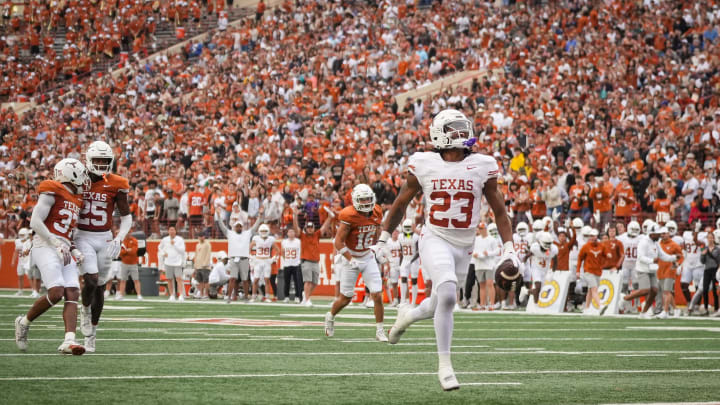 April 20, 2024; Austin, Texas, USA: Texas White team running back Jaydon Blue runs the ball in for a touchdown in the Longhorns' spring Orange and White game at Darrell K Royal Texas Memorial Stadium. Mandatory Credit: Sara Diggins-USA Today Sports via American Statesman