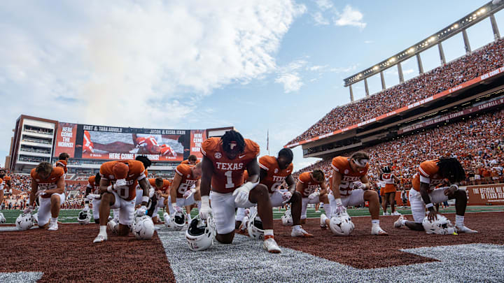 The Texas Longhorns pray ahead of their game against the UTSA Roadrunners at Darrell K RoyalÐTexas Memorial Stadium, Saturday, Sept. 14, 2024. Texas won the game 56-7.