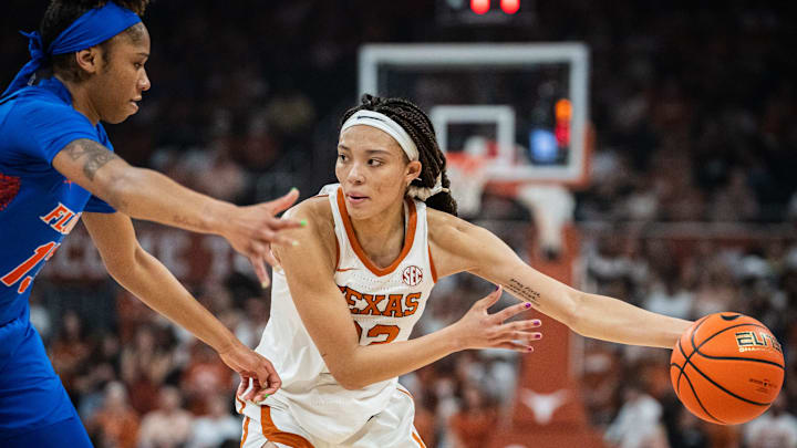 Texas Longhorns guard Ndjakalenga Mwenentanda (32) looks for an opening around Florida Gators guard Laila Reynolds (13) in the first half of the Texas Longhorns' game against the Florida Gators, March 2, 2025 at the Moody Center in Austin. Texas Longhorns guard Ndjakalenga Mwenentanda (32) looks for an opening around Florida Gators guard Laila Reynolds (13) in the first half of the Texas Longhorns' game against the Florida Gators, March 2, 2025 at the Moody Center in Austin.