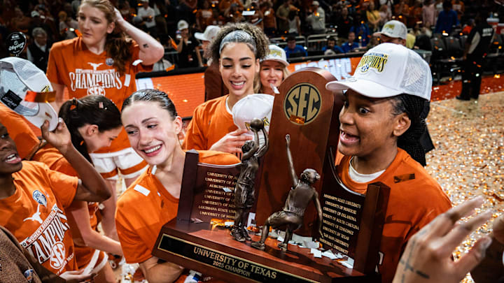 The Texas Longhorns, including Texas Longhorns guard Shay Holle (10) and forward Madison Booker (35) celebrate their regular season SEC Championship after beating Florida at home in the Moody Center, March 2, 2025. The Texas Longhorns, including Texas Longhorns guard Shay Holle (10) and forward Madison Booker (35) celebrate their regular season SEC Championship after beating Florida at home in the Moody Center, March 2, 2025.