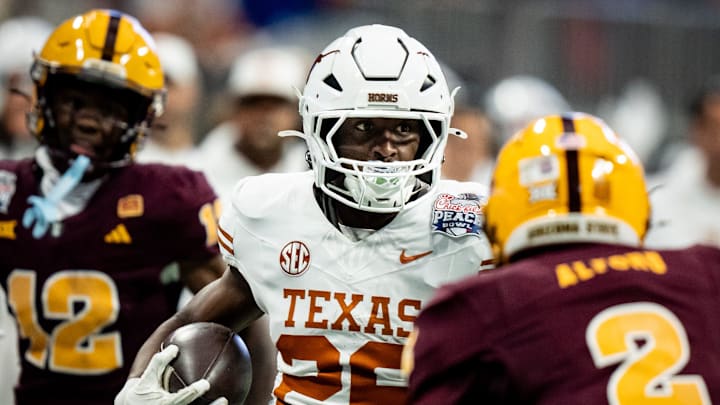 Texas Longhorns running back Quintrevion Wisner (26) runs the ball in the second quarter as the Texas Longhorns play the Arizona State Sun Devils in the Peach Bowl College Football Playoff quarterfinal at Mercedes-Benz Stadium in Atlanta, Georgia, Jan. 1, 2025. Texas Longhorns running back Quintrevion Wisner (26) runs the ball in the second quarter as the Texas Longhorns play the Arizona State Sun Devils in the Peach Bowl College Football Playoff quarterfinal at Mercedes-Benz Stadium in Atlanta, Georgia, Jan. 1, 2025.