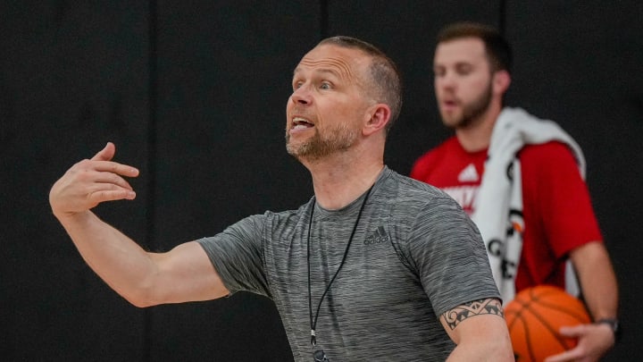 Louisville coach Pat Kelsey works with his team during practice before the Cards head to the Bahamas.