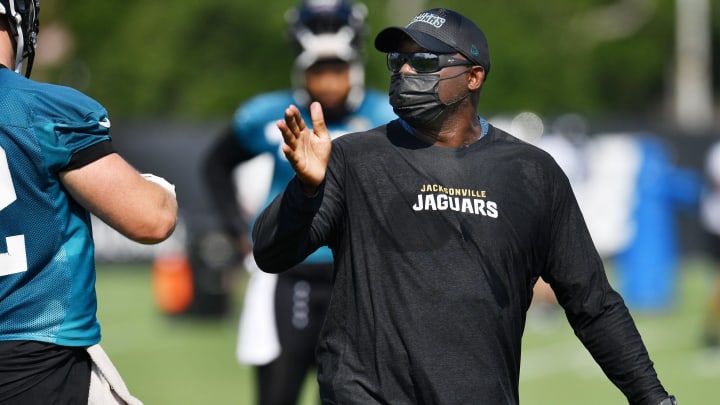 Jaguars offensive line coach George Warhop wears a mask as he instructs his players. The Jacksonville Jaguars training camp session, Wednesday, July 28, 2021, at the team's practice fields outside TIAA Bank Field. [Bob Self/Florida Times-Union]

Jki 072821 Jagstrainingcam