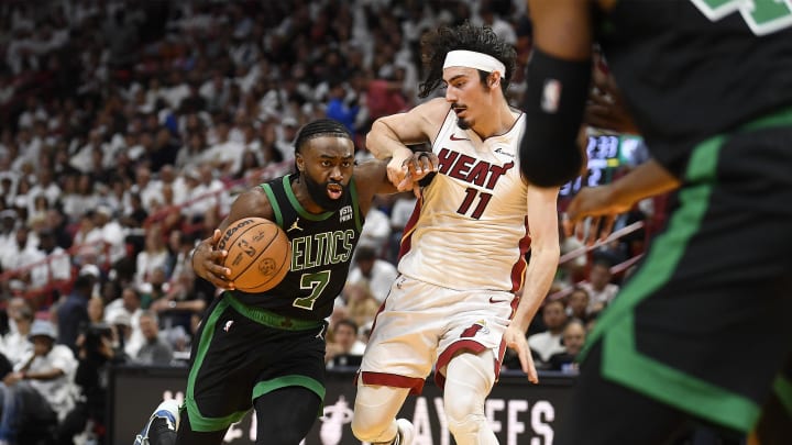 Apr 29, 2024; Miami, Florida, USA; Boston Celtics guard Jaylen Brown (7) drives into Miami Heat - Michael Laughlin/USA TODAY Sports