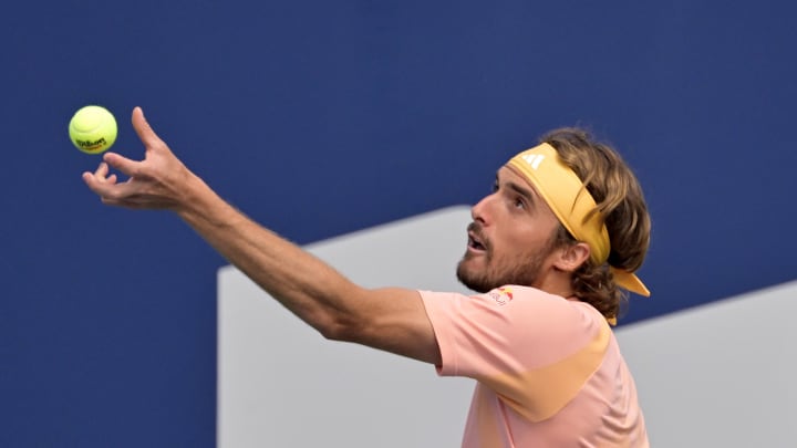 Aug 8, 2024; Montreal, Quebec, Canada; Stefanos Tsitsipas (GRE) serves against Kei Nishikori (JPN) (not pictured) in second round play at IGA Stadium.