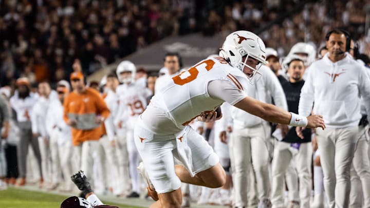 Texas quarterback Arch Manning dives for the pylon during the No. 3 Longhorns' game against No. 20 Texas A&M on Nov. 30, 2024. Texas quarterback Arch Manning dives for the pylon during the No. 3 Longhorns' game against No. 20 Texas A&M on Nov. 30, 2024.