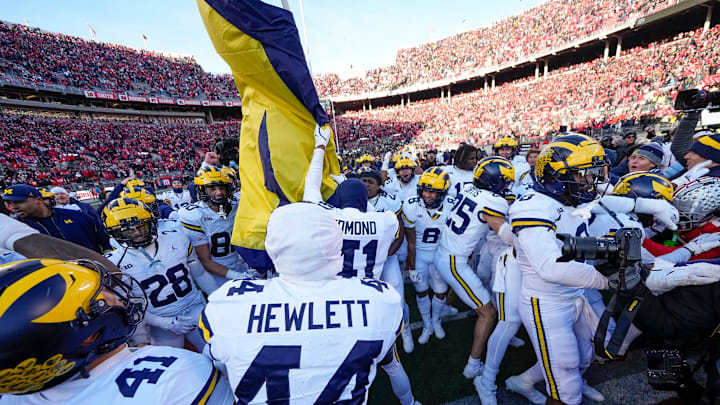 Michigan Wolverines plant a flag on the block-O at midfield following the NCAA football game against the Ohio State Buckeyes at Ohio Stadium. This would be illegal if the “O.H.I.O. Sportsmanship Act” is passed. 