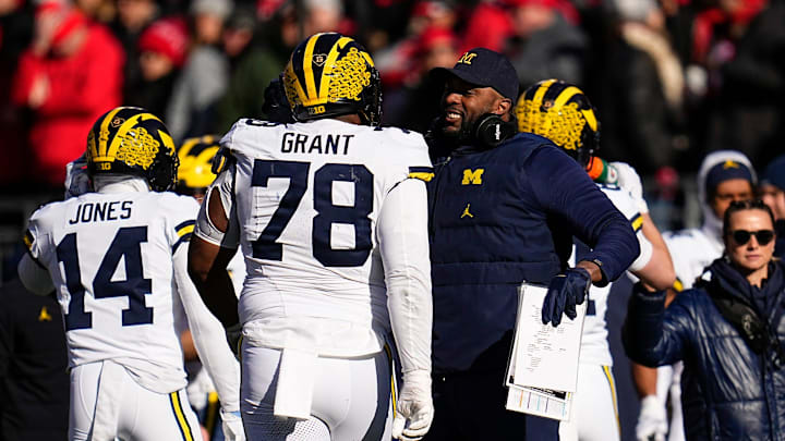 Michigan Wolverines head coach Sherrone Moore celebrates a stop by Michigan Wolverines defensive lineman Kenneth Grant